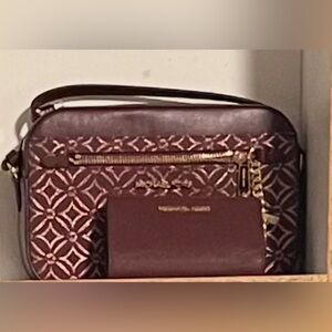MK Large Metallic Logo Jacquard Jet Set crossbody bag wallet sold separately.